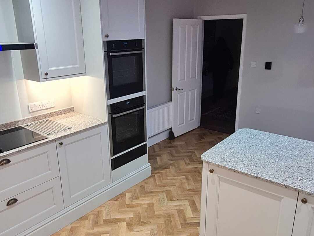 Built-in double ovens beside the cream units